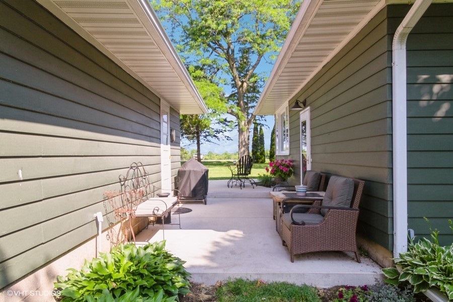 5602 Pagles Road Harvard, IL 60033 - Photo 17 of 23 a view of backyard with outdoor seating and plants