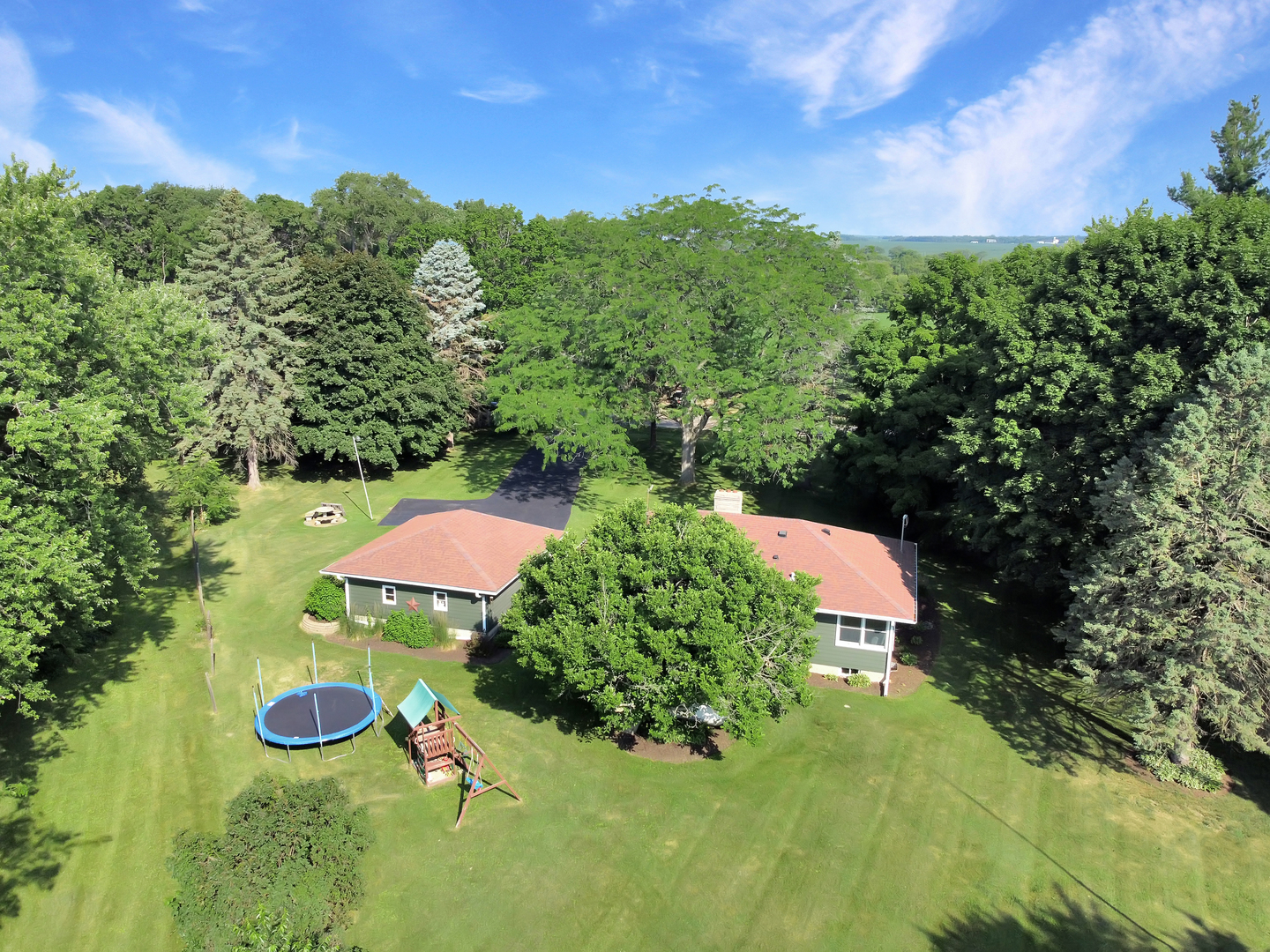 5602 Pagles Road Harvard, IL 60033 - Photo 20 of 23 a backyard of a house with yard and outdoor seating