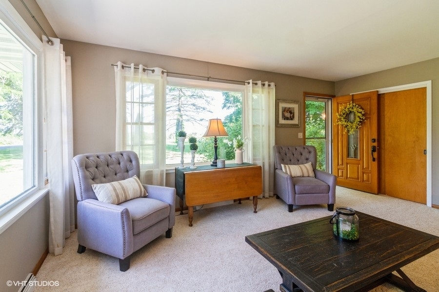5602 Pagles Road Harvard, IL 60033 - Photo 2 of 23 a living room with furniture and a large window