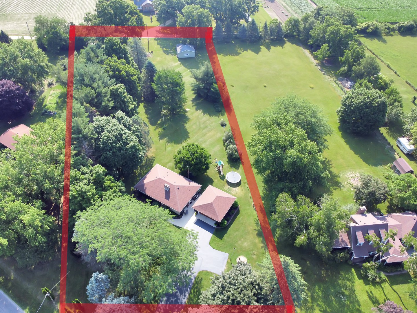 5602 Pagles Road Harvard, IL 60033 - Photo 23 of 23 an aerial view of a house with a yard and garden