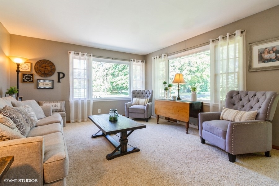 5602 Pagles Road Harvard, IL 60033 - Photo 3 of 23 a living room with furniture and a large window