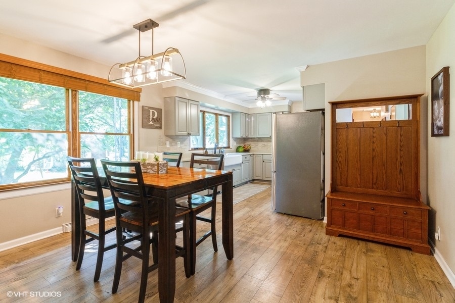 5602 Pagles Road Harvard, IL 60033 - Photo 4 of 23 a view of a dining room with furniture window and wooden floor
