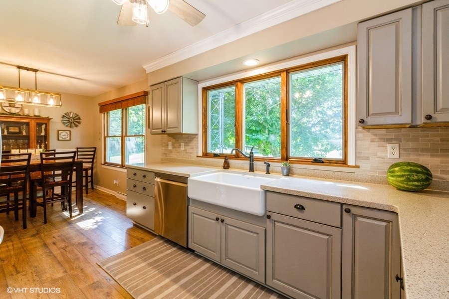 5602 Pagles Road Harvard, IL 60033 - Photo 5 of 23 a kitchen with stainless steel appliances granite countertop a sink and cabinets