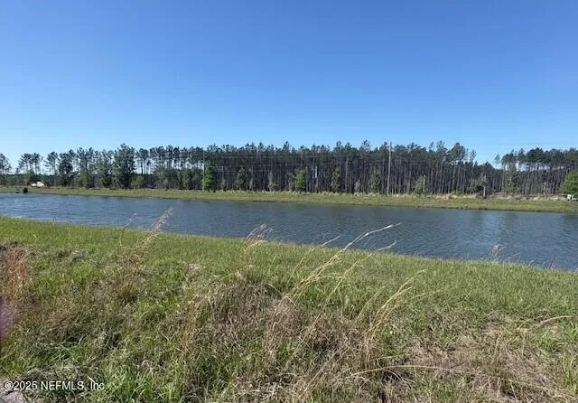 a view of a lake with a big yard