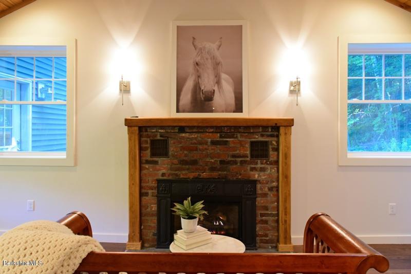 16 Mahkeenac Road Stockbridge, MA 01262 - Photo 11 of 26 a living room with furniture and a fireplace