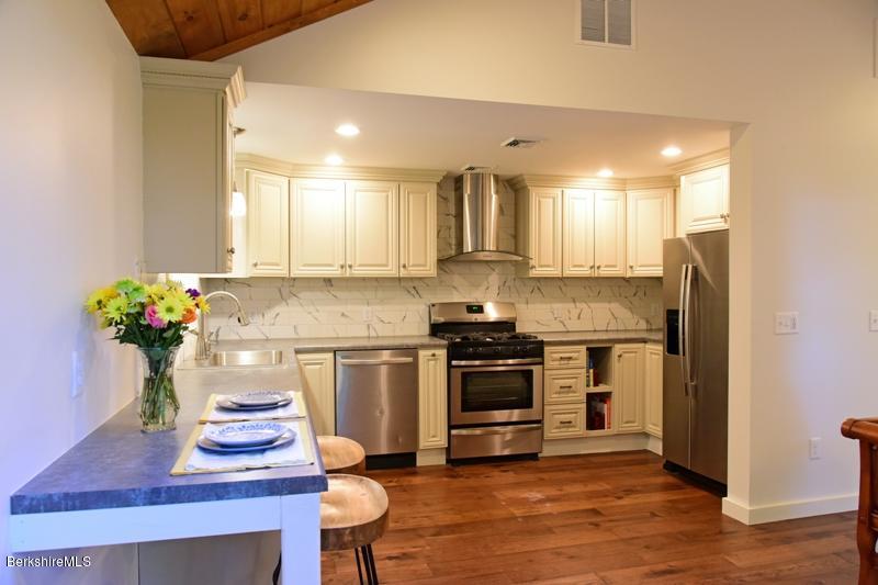 16 Mahkeenac Road Stockbridge, MA 01262 - Photo 14 of 26 a kitchen with a refrigerator and a stove