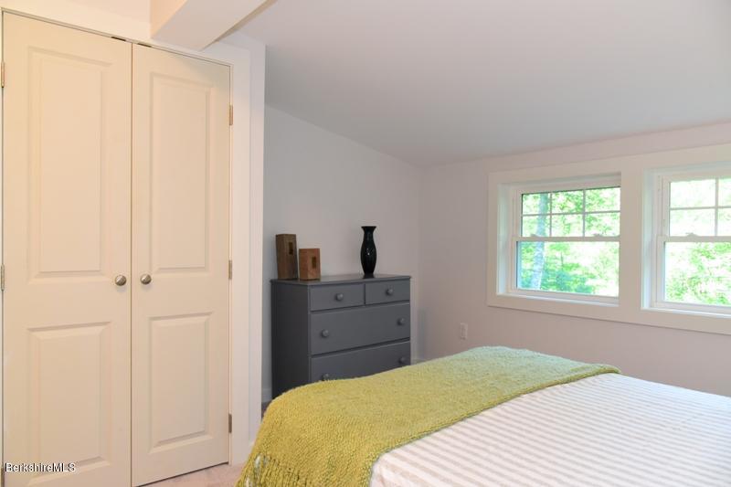 16 Mahkeenac Road Stockbridge, MA 01262 - Photo 20 of 26 a bedroom with a bed and a window