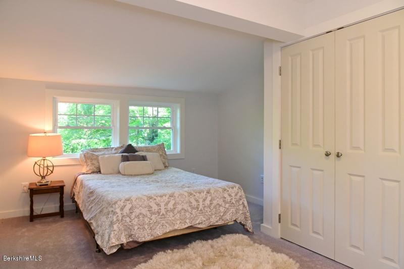 16 Mahkeenac Road Stockbridge, MA 01262 - Photo 22 of 26 a bedroom with a large bed and a window