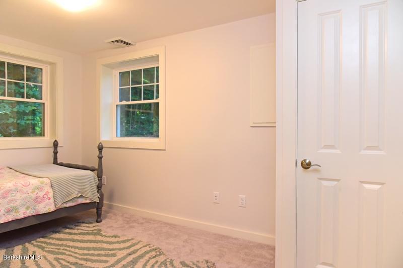 16 Mahkeenac Road Stockbridge, MA 01262 - Photo 26 of 26 a bedroom with a bed and a window