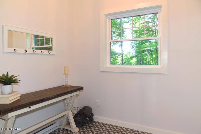 16 Mahkeenac Road Stockbridge, MA 01262 - Photo 5 of 26 a room with a window and a potted plant