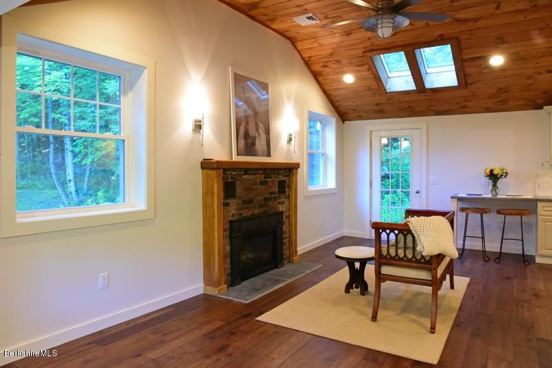 16 Mahkeenac Road Stockbridge, MA 01262 - Photo 9 of 26 a living room with furniture and a fireplace