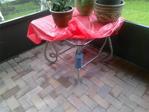 a view of a chairs and table in the garden