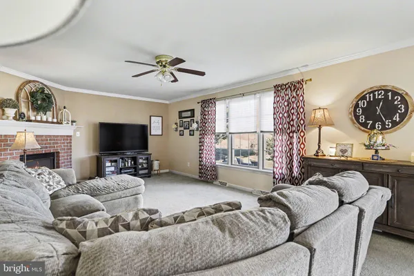 a living room with a fireplace and a fireplace