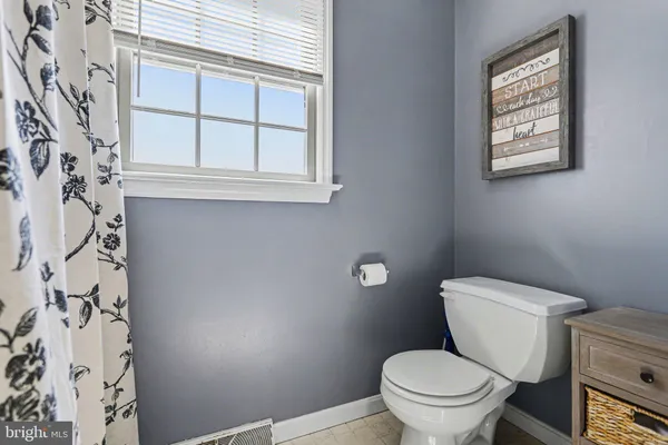 a bedroom with a bed and glass window