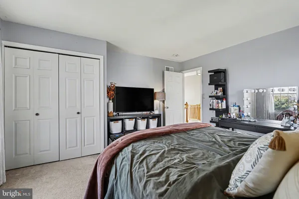 a bedroom with a bed and furniture