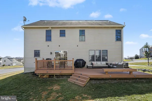 a backyard of a house with table and chairs