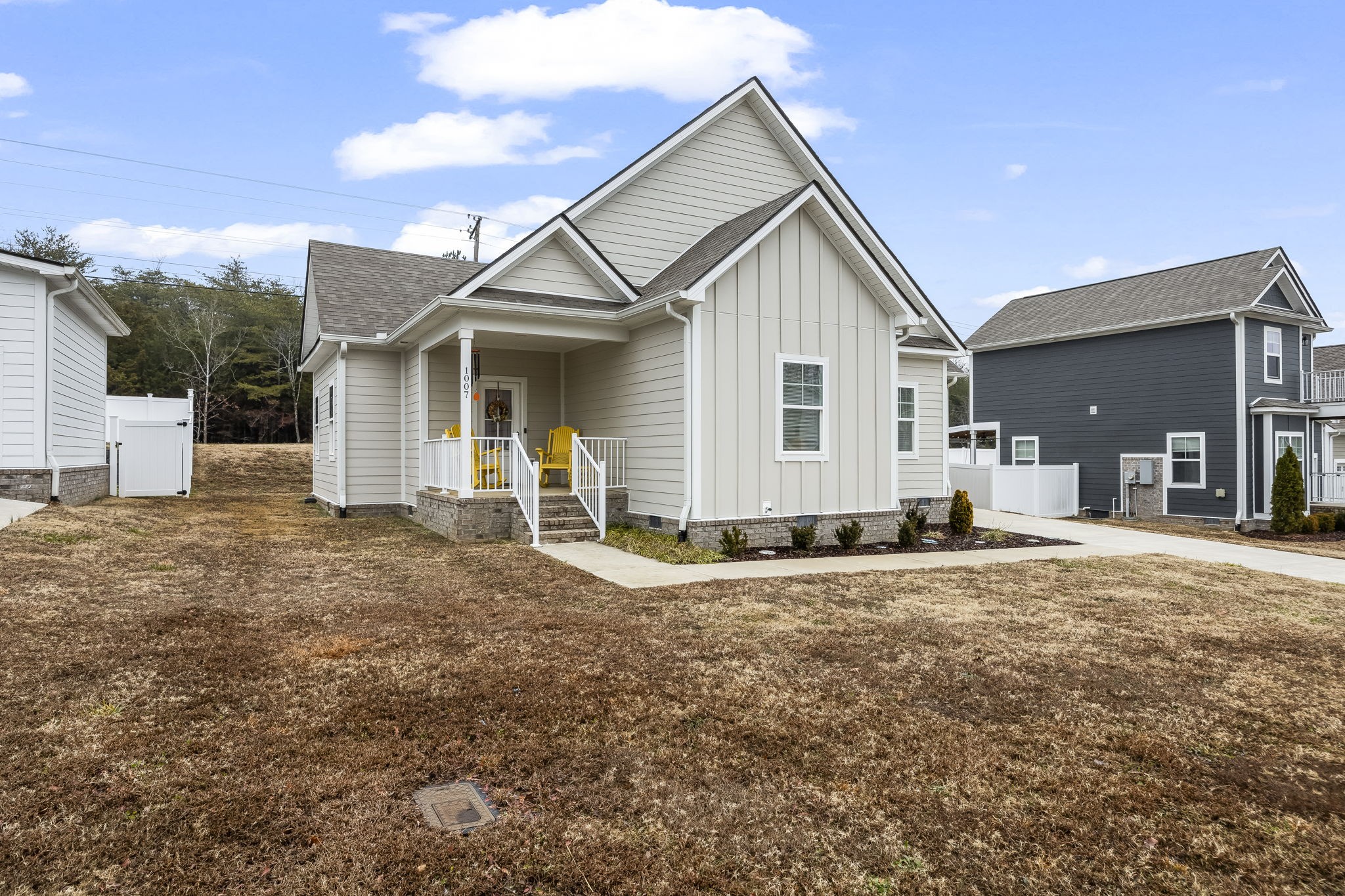 1007 Sycamore Ridge East Burns, TN 37029 - Photo 1 of 28 a view of a house with backyard and a tree