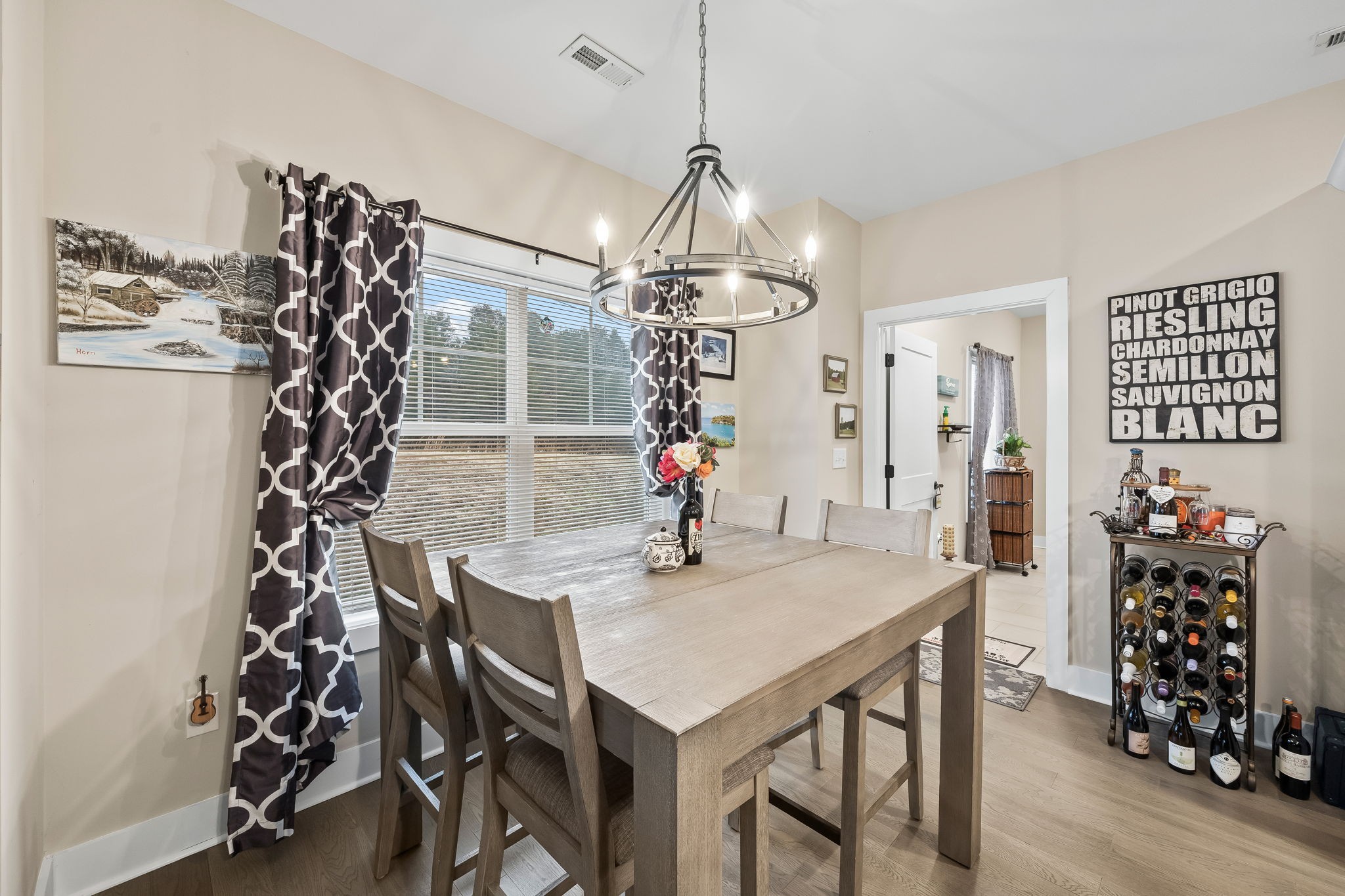 1007 Sycamore Ridge East Burns, TN 37029 - Photo 13 of 28 a view of a dining room with furniture and chandelier