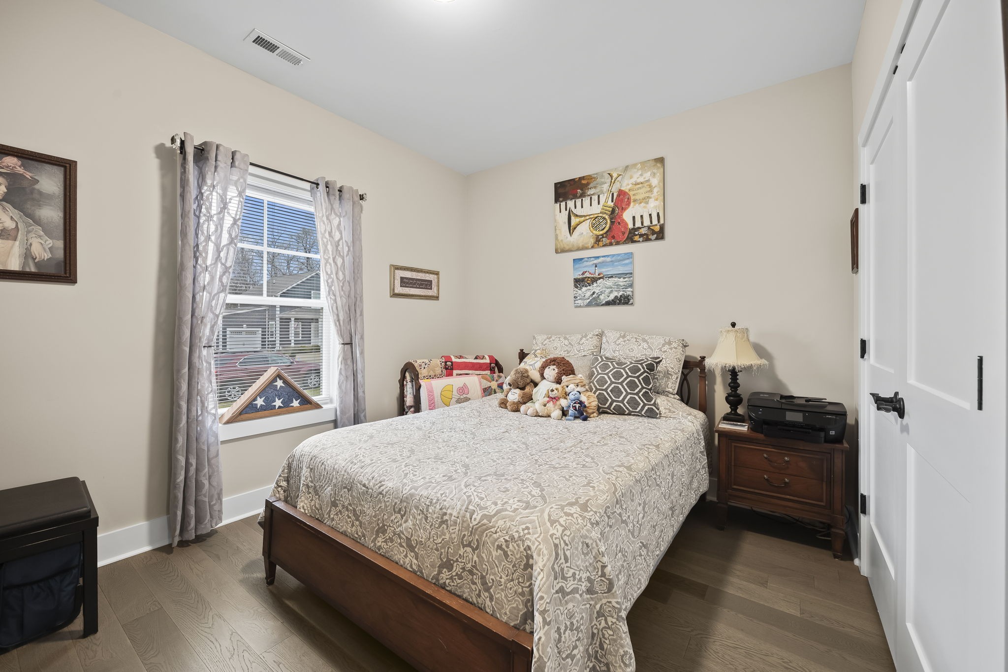 1007 Sycamore Ridge East Burns, TN 37029 - Photo 21 of 28 a bedroom with a bed and wooden floor