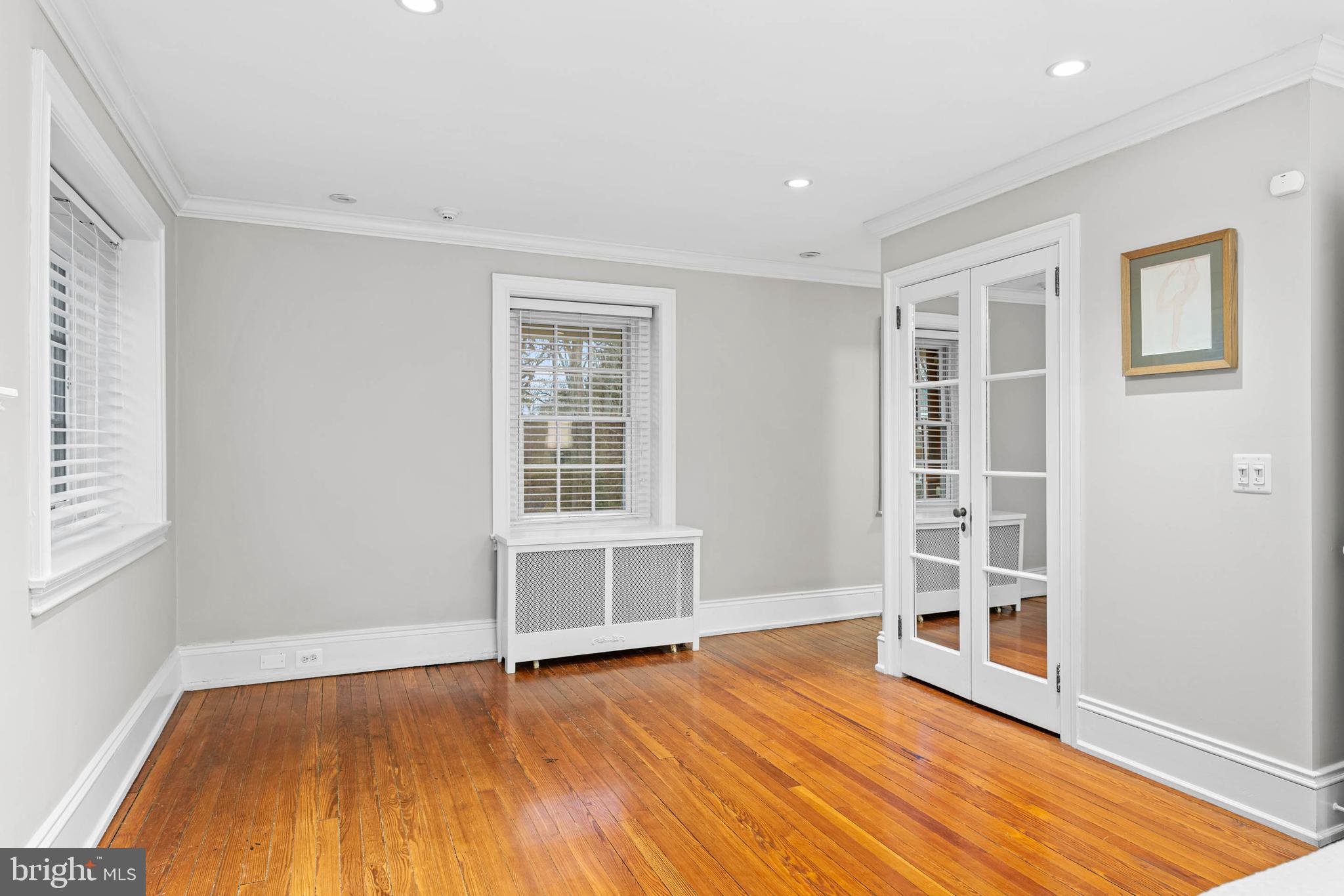214 Roberts Road Ardmore, PA 19003 - Photo 27 of 63 an empty room with wooden floor and windows