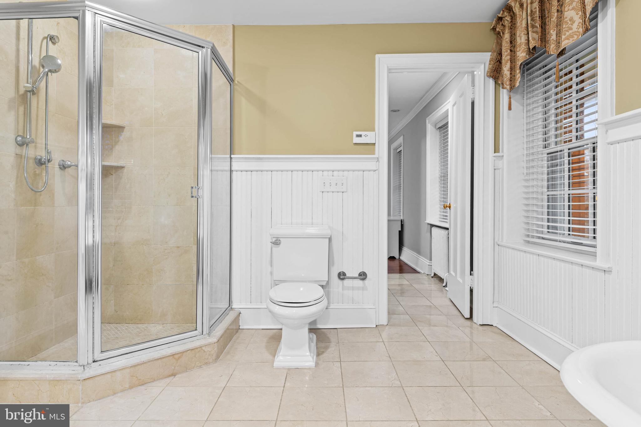 214 Roberts Road Ardmore, PA 19003 - Photo 32 of 63 a bathroom with a granite countertop shower a toilet and a sink