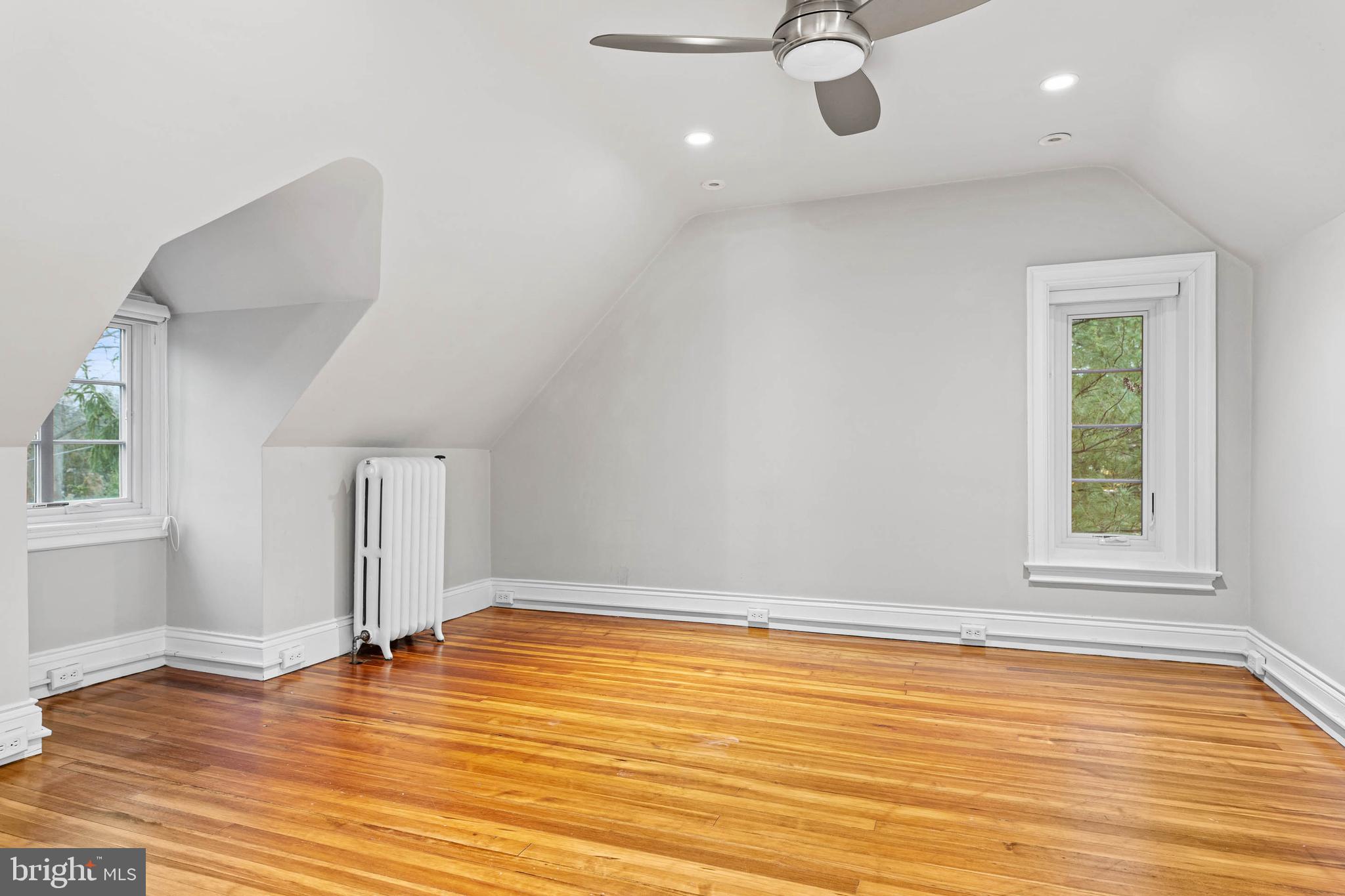 214 Roberts Road Ardmore, PA 19003 - Photo 42 of 63 an empty room with wooden floor and windows