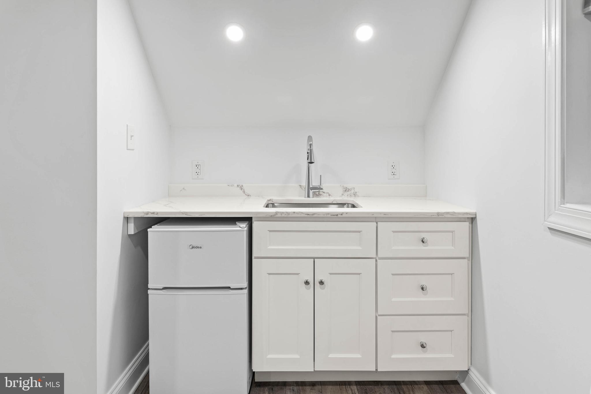 214 Roberts Road Ardmore, PA 19003 - Photo 46 of 63 a bathroom with a sink vanity and a mirror