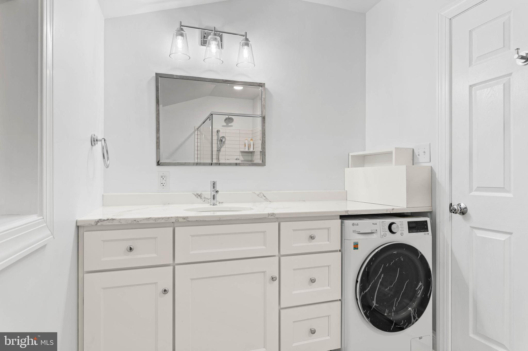 214 Roberts Road Ardmore, PA 19003 - Photo 48 of 63 a bathroom with a sink and a mirror