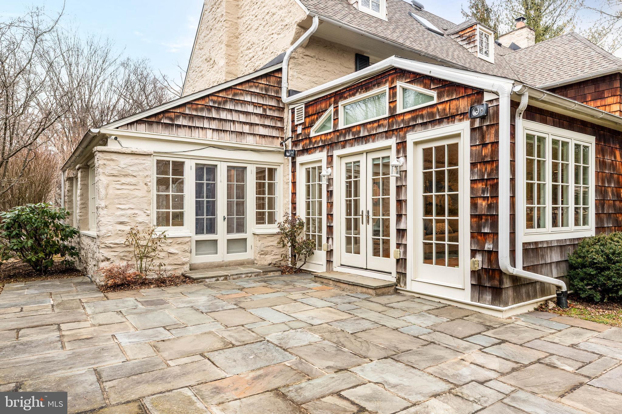 214 Roberts Road Ardmore, PA 19003 - Photo 58 of 63 a front view of a brick house with many windows