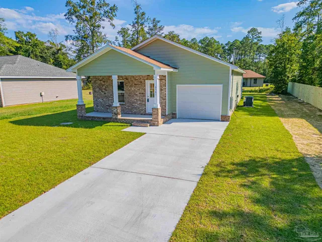 a front view of a house with yard