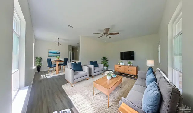 a living room with furniture and a flat screen tv