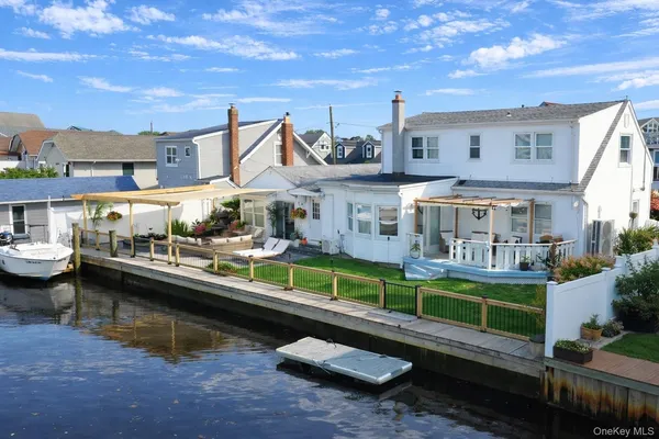 a view of house with swimming pool outdoor seating