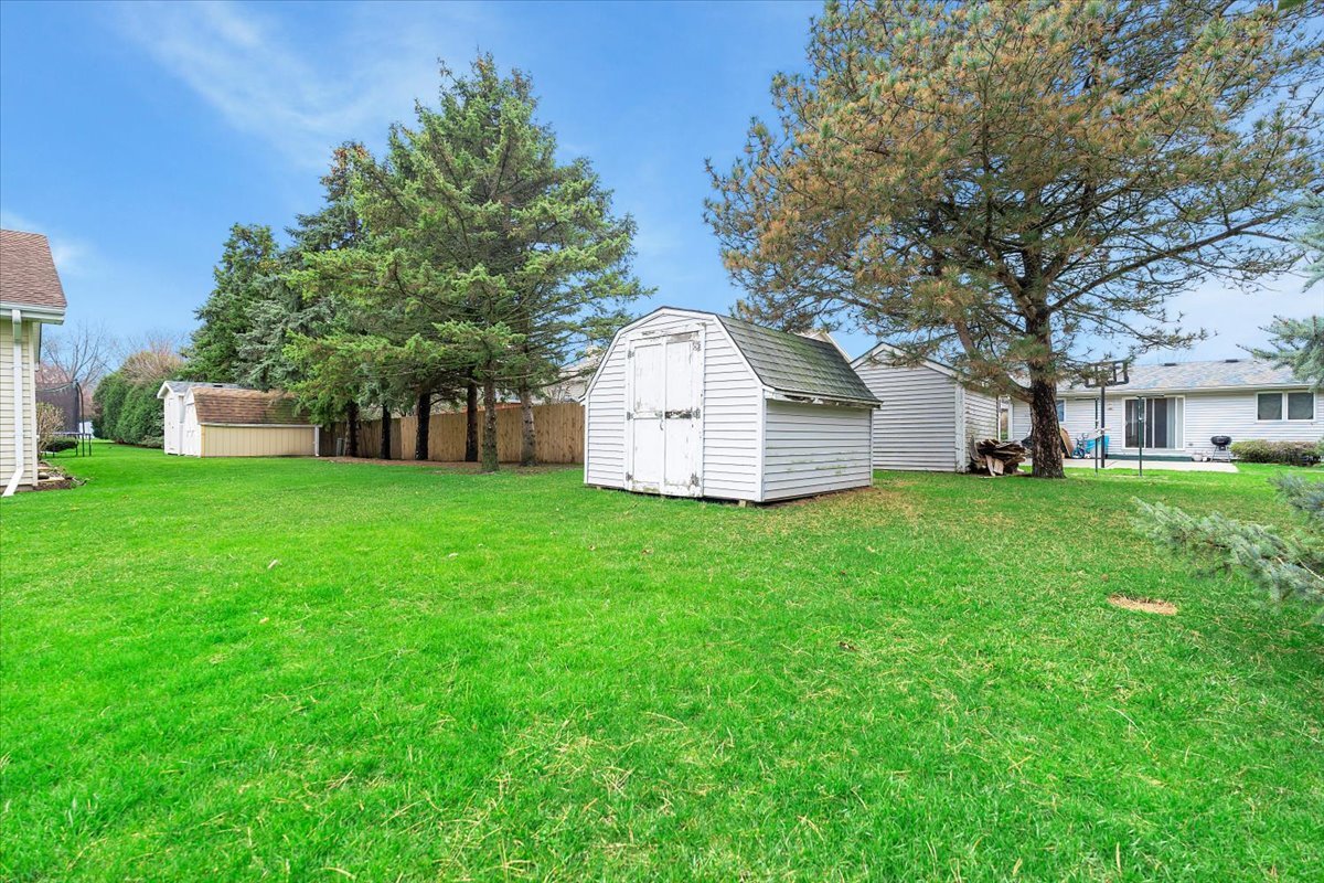 1200 2nd Street Harvard, IL 60033 - Photo 11 of 22 a view of a house with backyard and tree