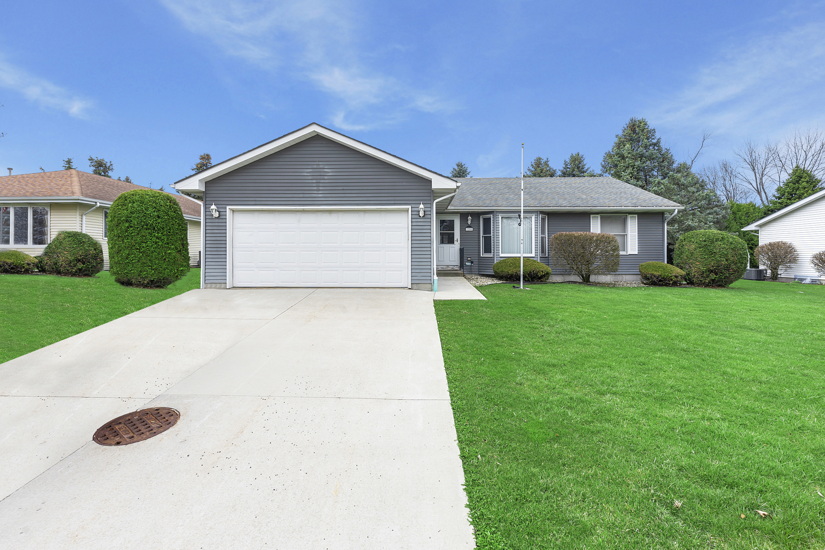 1200 2nd Street Harvard, IL 60033 - Photo 2 of 22 a front view of a house with yard garage and trees