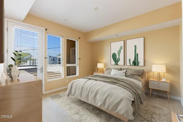 a bedroom with a bed and a mirror
