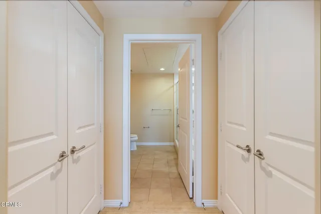 a spacious bathroom with a bathtub sink and mirror
