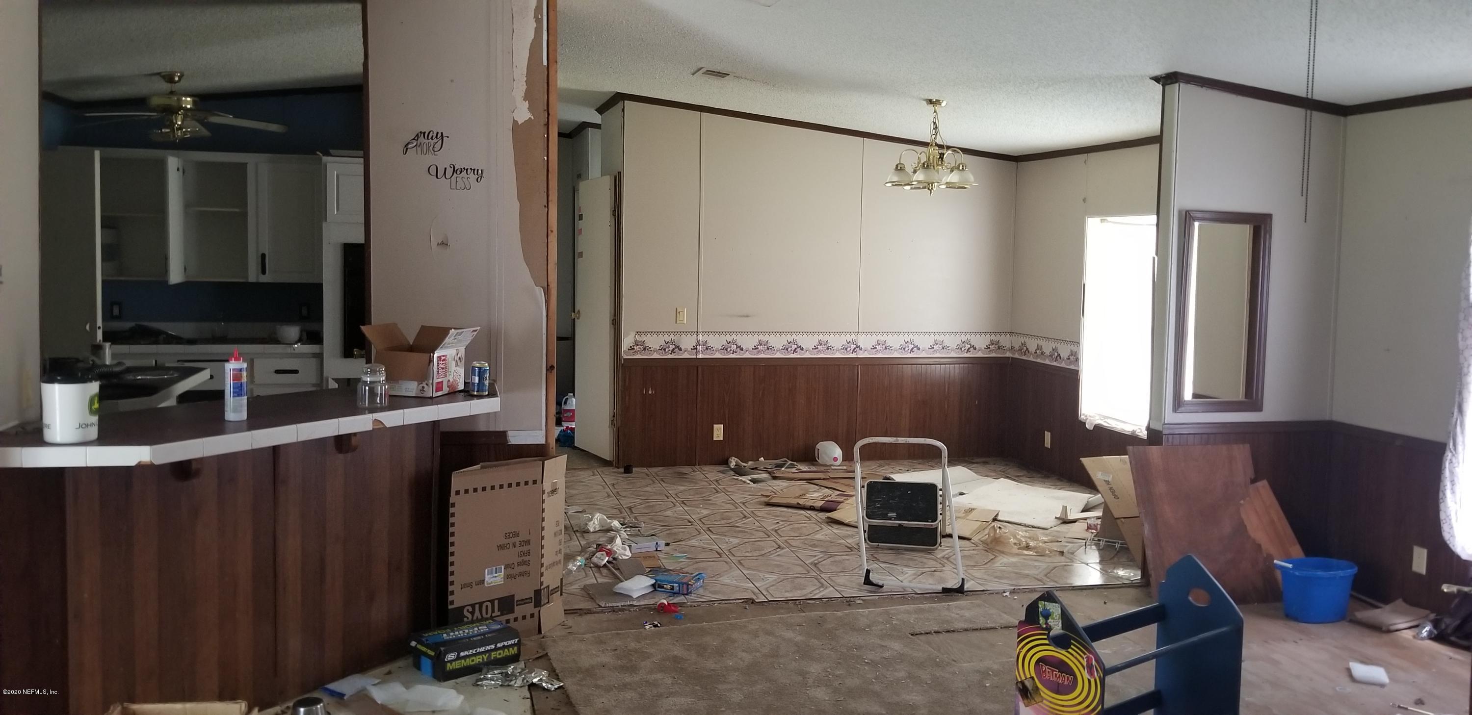 14003 Bradham Road Jacksonville, FL 32226 - Photo 13 of 30 a bathroom with a sink mirror and vanity