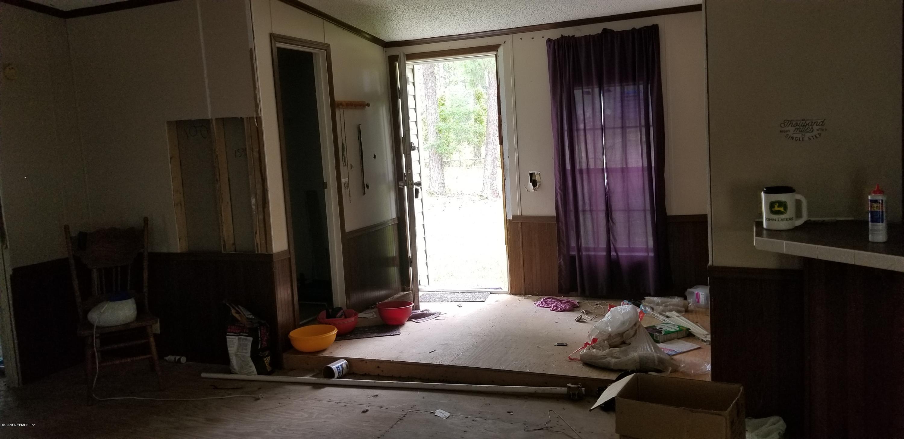 14003 Bradham Road Jacksonville, FL 32226 - Photo 18 of 30 a bedroom with furniture and windows