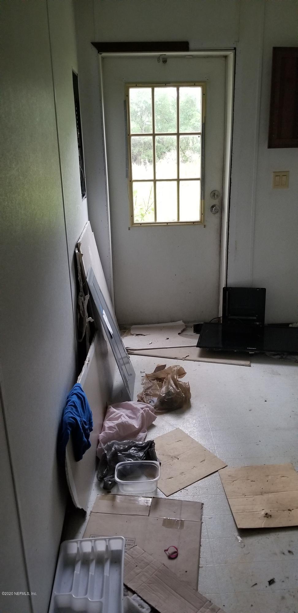 14003 Bradham Road Jacksonville, FL 32226 - Photo 24 of 30 a living room with furniture and a window