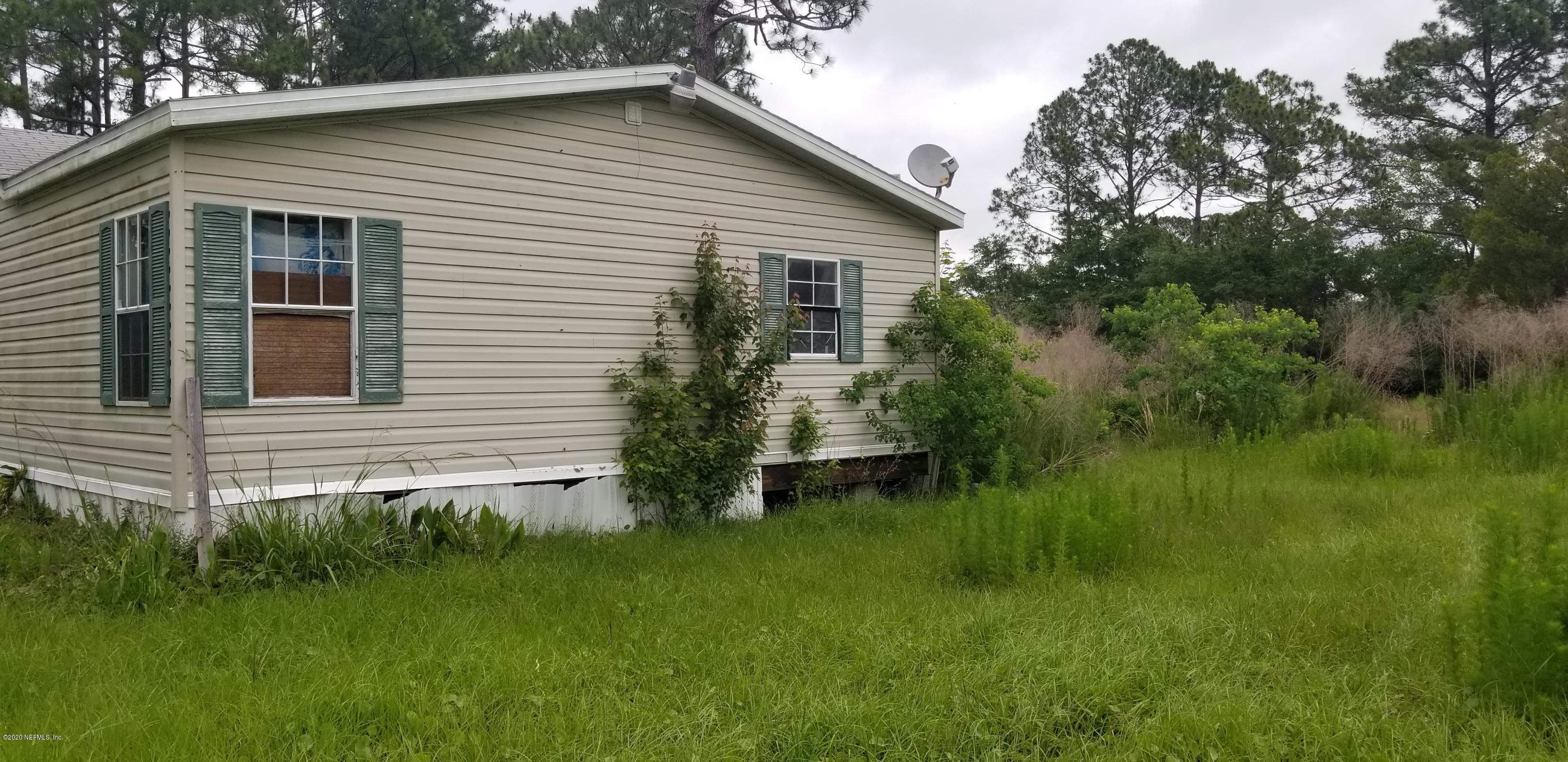 14003 Bradham Road Jacksonville, FL 32226 - Photo 5 of 30 a view of a house with a yard