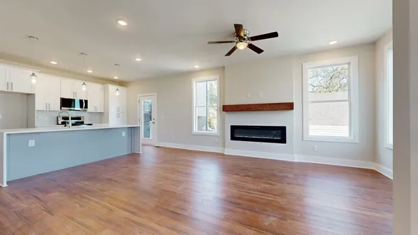 a view of a house with wooden fence