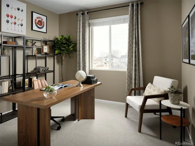 a view of a workspace with furniture and a potted plant