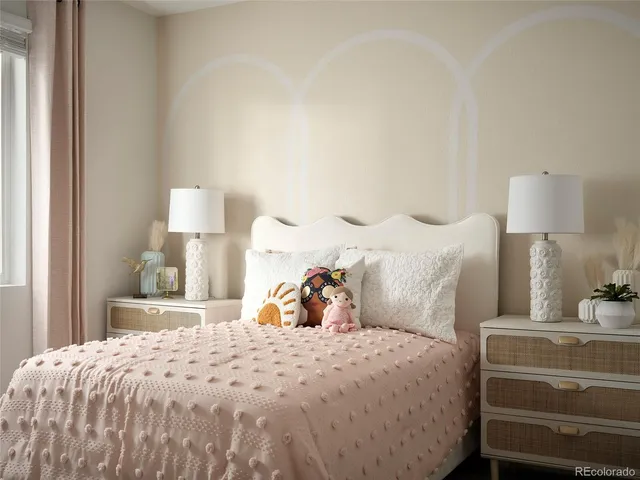 a bedroom with a bed and a lamp