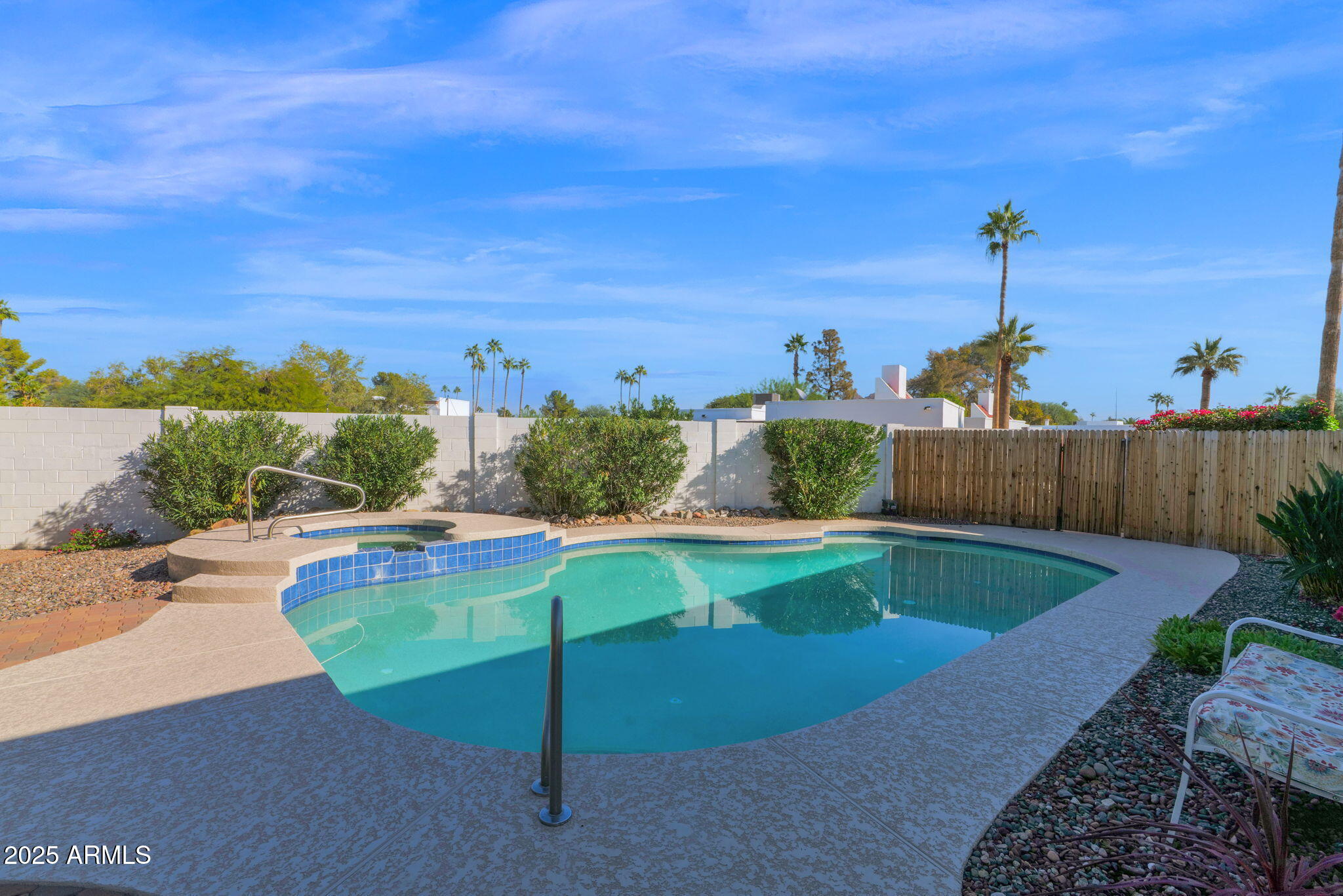 501 East Calavar Road Phoenix, AZ 85022 - Photo 26 of 50 a view of a swimming pool with a patio and a yard