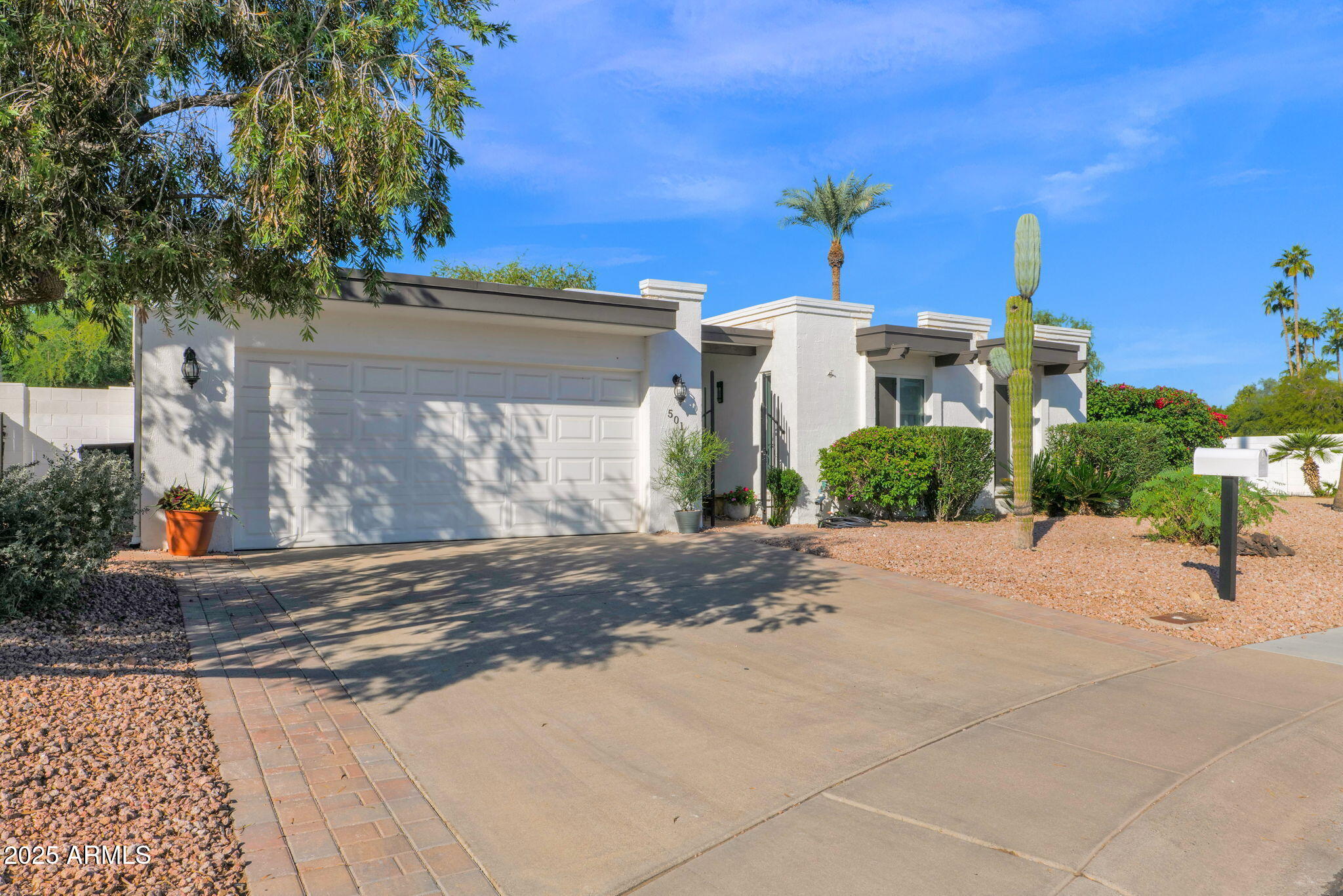 501 East Calavar Road Phoenix, AZ 85022 - Photo 3 of 50 a front view of a house with a yard and garage