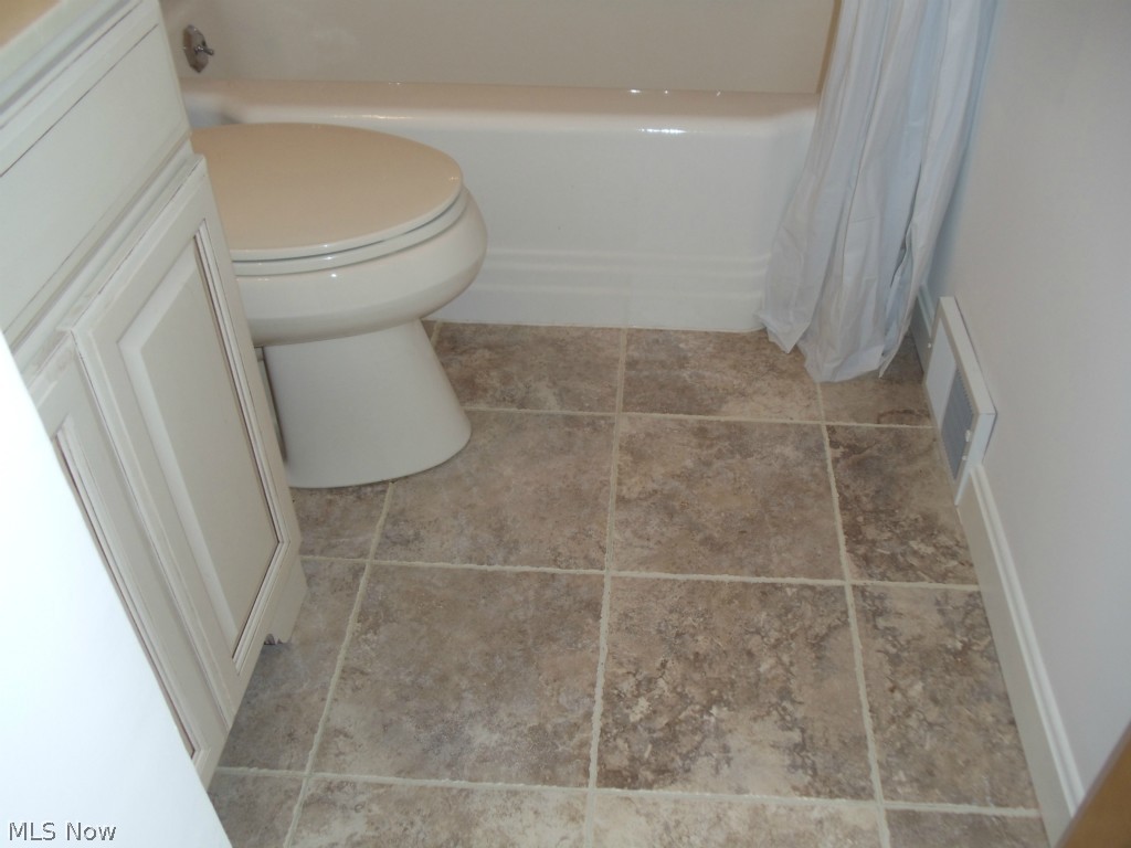 980 East Green Road Cleveland, OH 44121 - Photo 13 of 25 CERAMIC FLOORING IN THE BATH FOR EASY MAINTENANCE IN TODAY'S COLORS.
