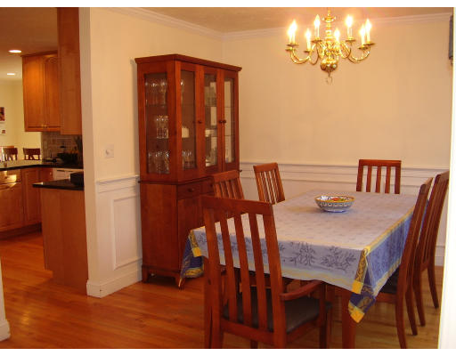 93 Spiers Road Newton, MA 02459 - Photo 5 of 11 a view of a dining room with furniture and a chandelier