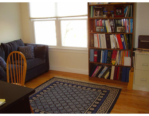 93 Spiers Road Newton, MA 02459 - Photo 8 of 11 a living room with a couch and a book shelf