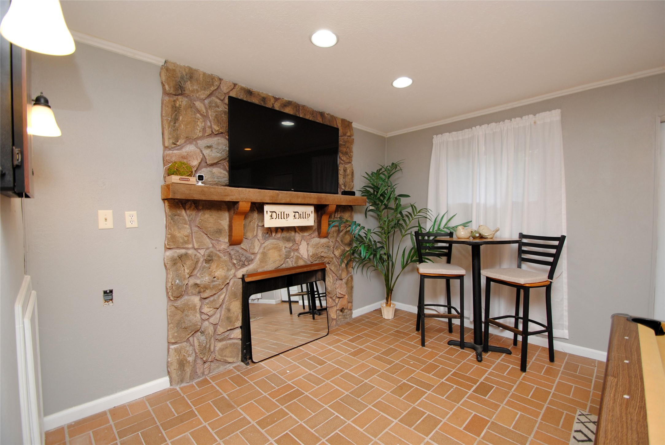 59 Paradise Loop Point Blank, TX 77364 - Photo 22 of 39 Wood burning fireplace in the game room.