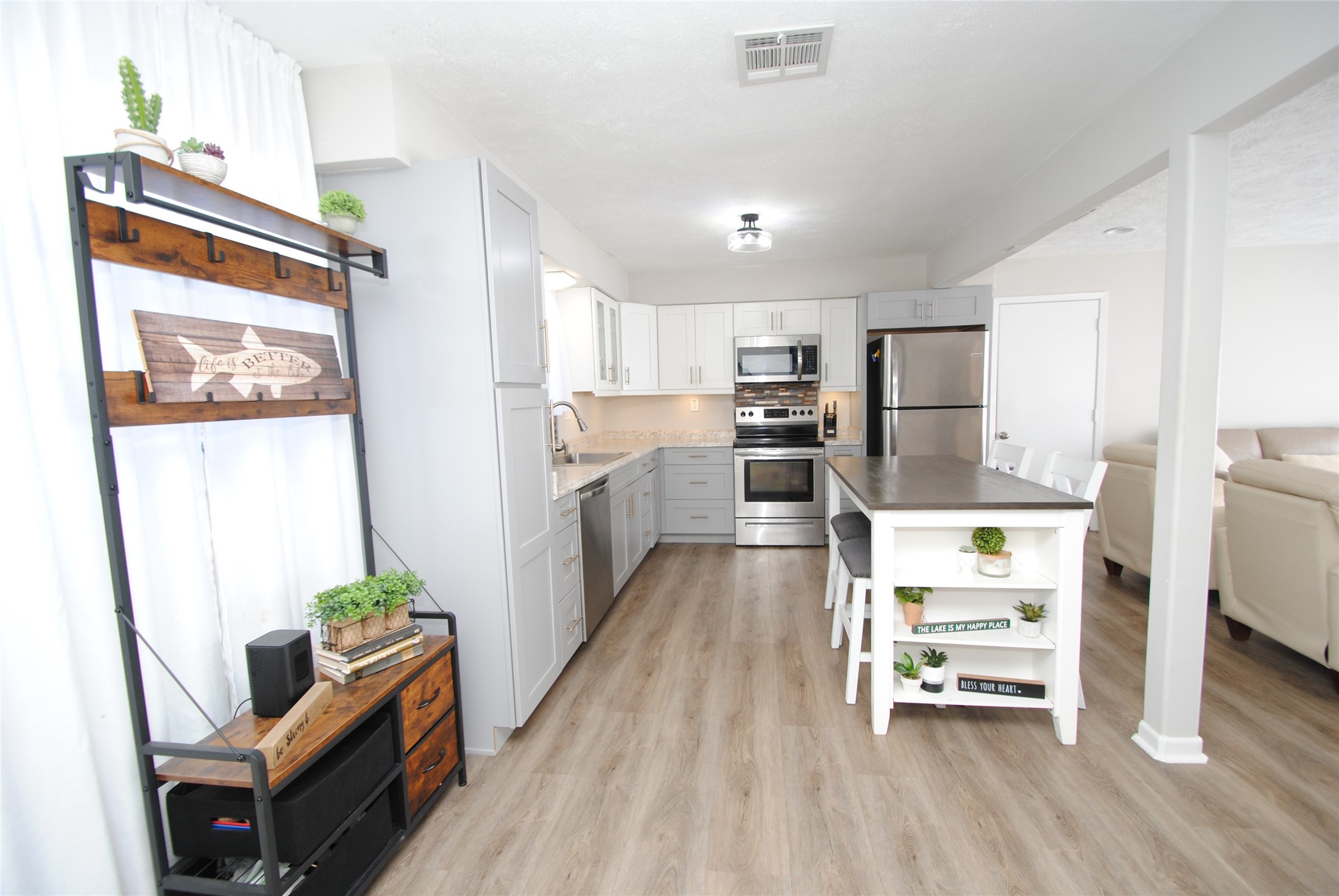 59 Paradise Loop Point Blank, TX 77364 - Photo 6 of 39 The kitchen features updated cabinets and appliances.